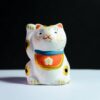 Maneki-Neko Figurine On White Surface